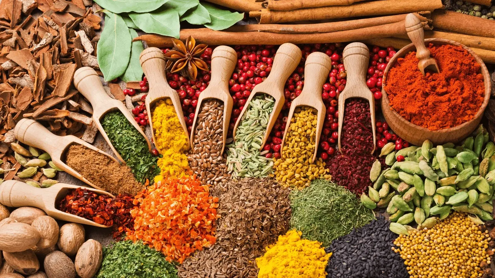 Assorted Indian whole spices and ground spice powders