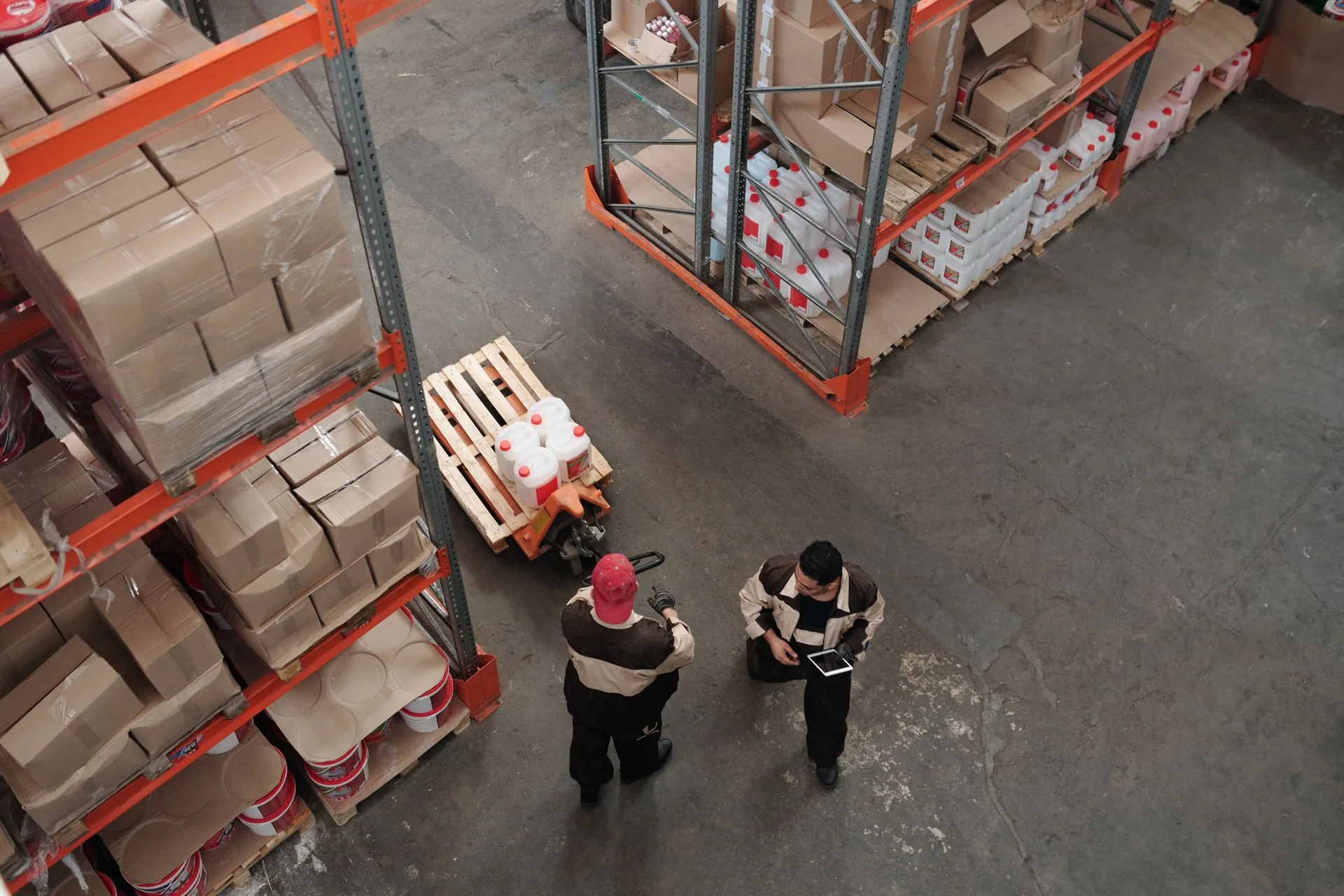 Warehouse team coordinating stored goods and dispatch operations
